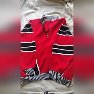 Red, black. and white long sleeve sweater